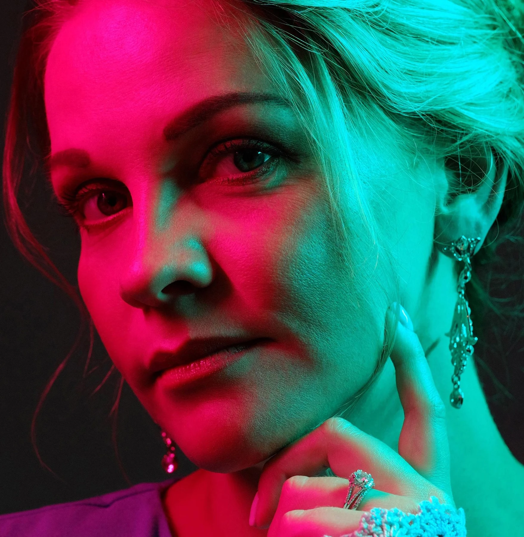 Featured beauty retouching of a portrait lit with pink and teal gels